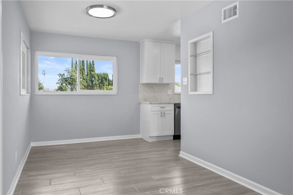 1791 Sitka Avenue Simi Valley, CA 93063 - Photo 26 of 44 a view of kitchen with wooden floor and window
