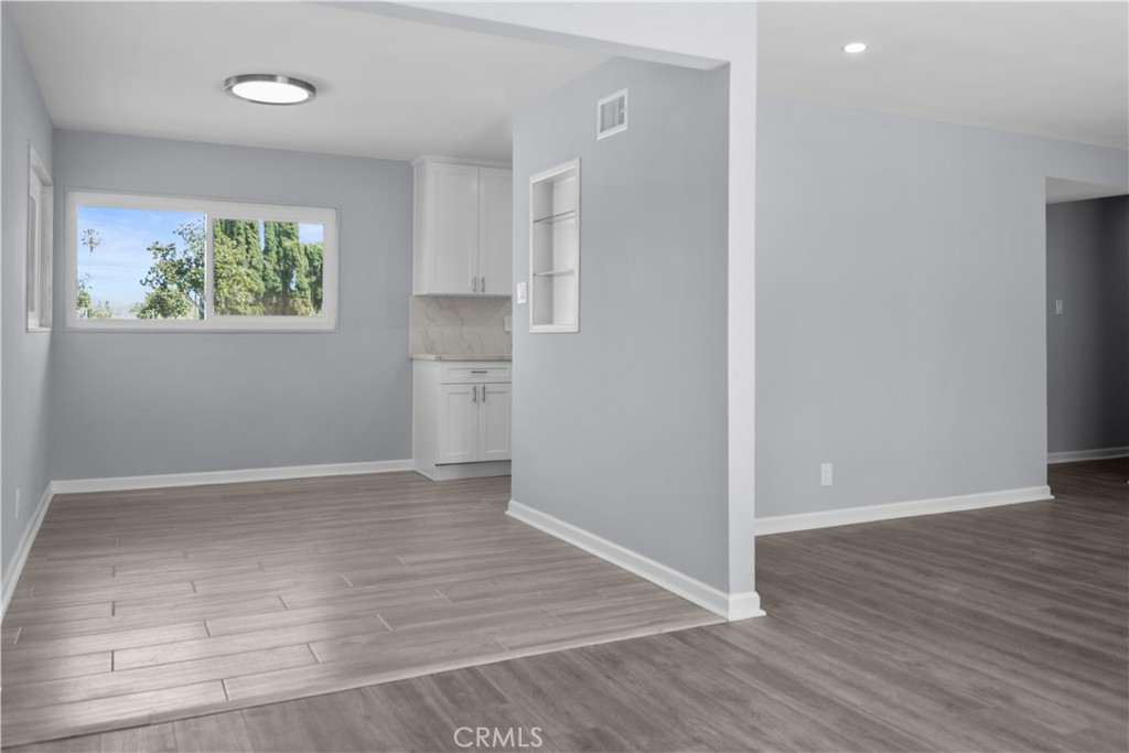 1791 Sitka Avenue Simi Valley, CA 93063 - Photo 28 of 44 an empty room with wooden floor and windows