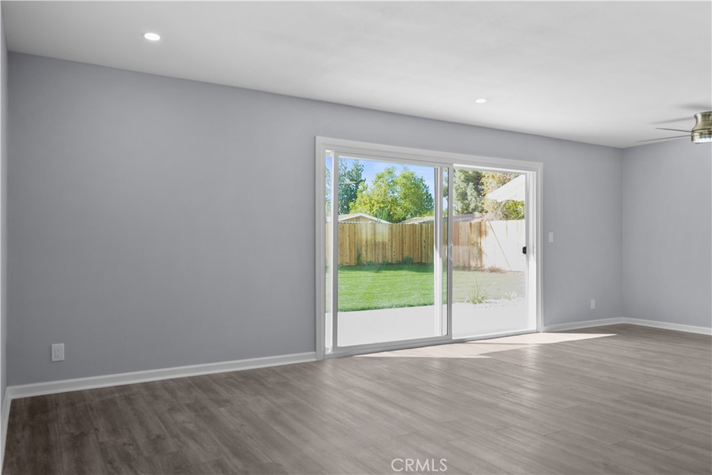1791 Sitka Avenue Simi Valley, CA 93063 - Photo 30 of 44 an empty room with wooden floor and windows