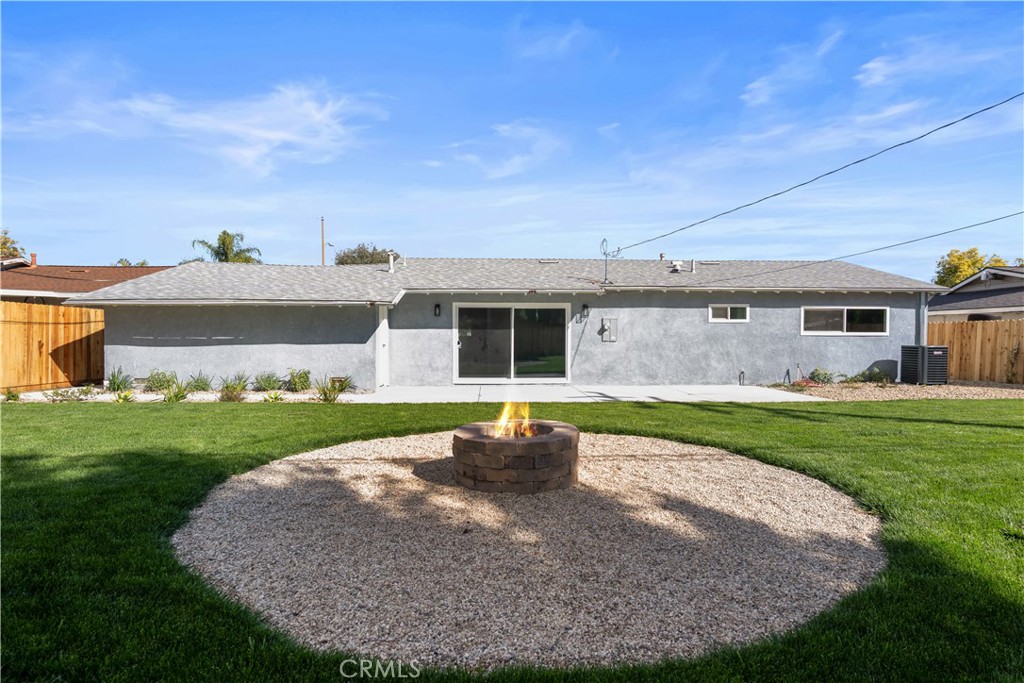1791 Sitka Avenue Simi Valley, CA 93063 - Photo 3 of 44 a front view of a house with a garden and plants