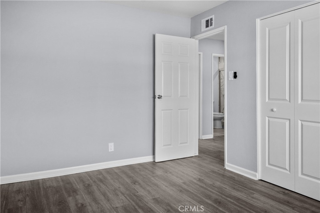 1791 Sitka Avenue Simi Valley, CA 93063 - Photo 37 of 44 a view of an empty room with wooden floor