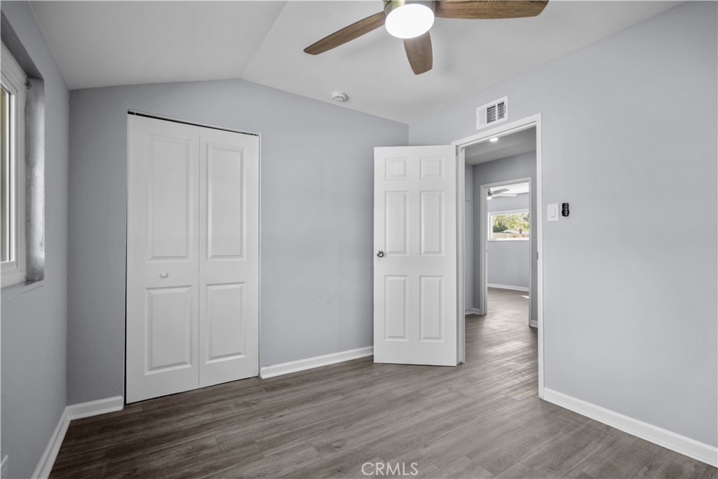 1791 Sitka Avenue Simi Valley, CA 93063 - Photo 39 of 44 an empty room with wooden floor closet and windows
