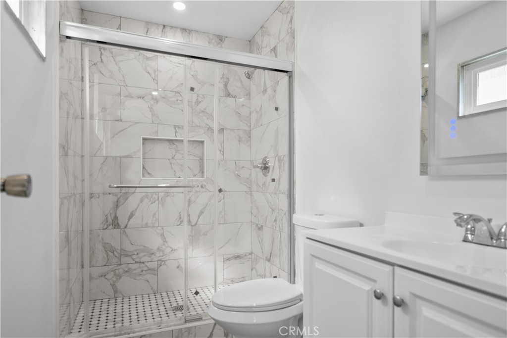 1791 Sitka Avenue Simi Valley, CA 93063 - Photo 40 of 44 a bathroom with a sink toilet and shower