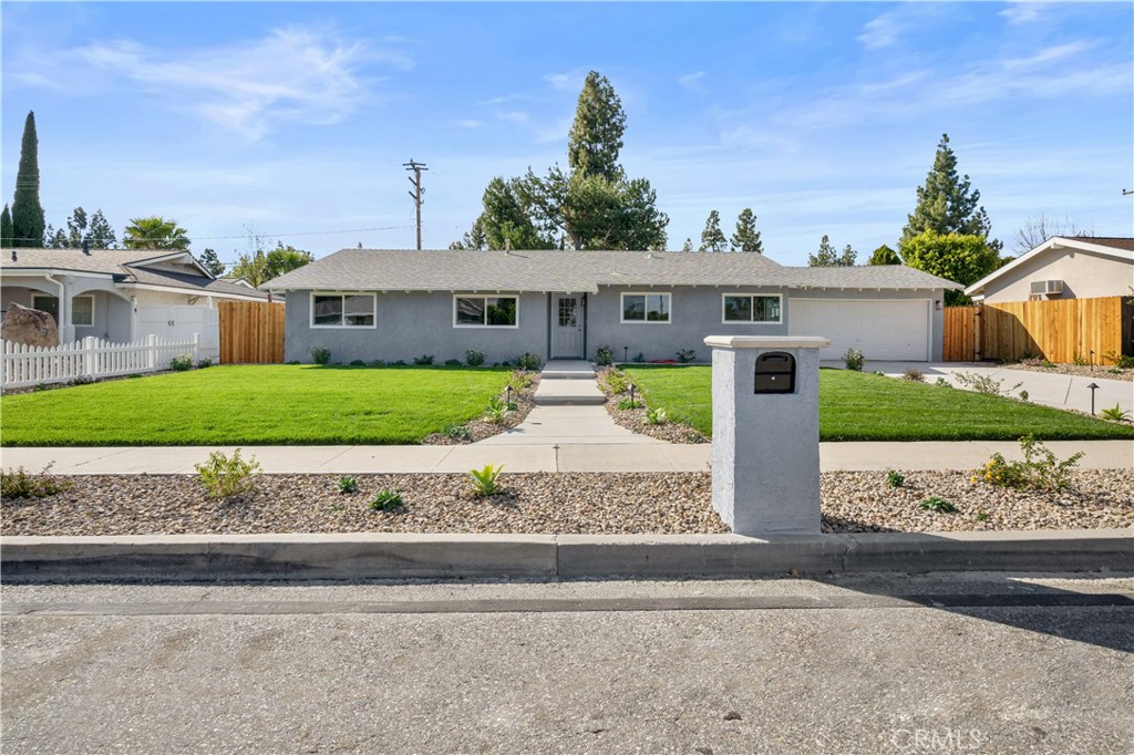 1791 Sitka Avenue Simi Valley, CA 93063 - Photo 5 of 44 a front view of a house with a yard and potted plants