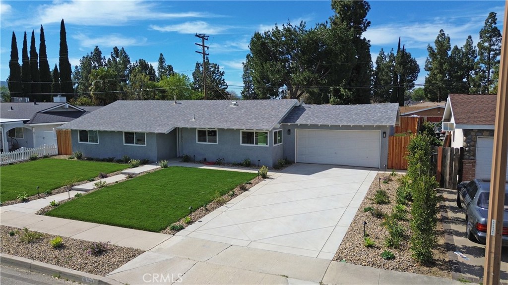 1791 Sitka Avenue Simi Valley, CA 93063 - Photo 6 of 44 a aerial view of a house with a yard and garage