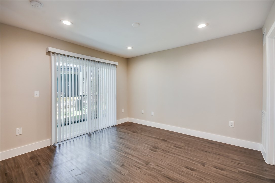 935 La Posada Drive, Unit 142 Austin, TX 78752 - Photo 15 of 28 wooden floor in an empty room