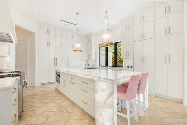 a kitchen with stainless steel appliances granite countertop a stove and a cabinets