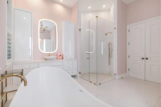 a spacious bedroom with a bed and a couch