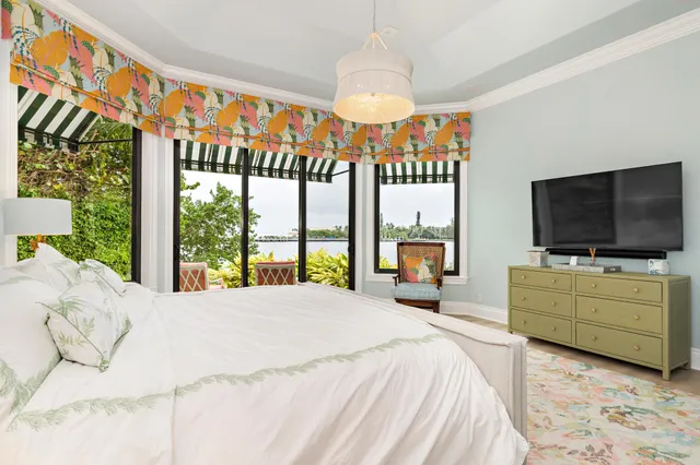 a front view of multi story residential apartment building with yard and green space