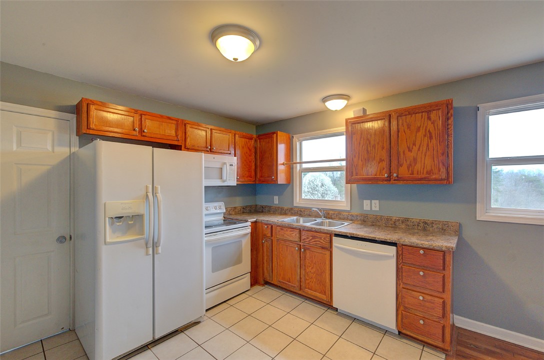 325 Rock Quarry Road Travelers Rest, SC 29690 - Photo 14 of 37 This bright kitchen offers ample cabinetry, modern appliances, and a functional layout.