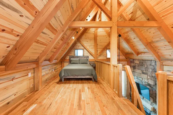 a kitchen with stainless steel appliances granite countertop a table chairs and a refrigerator