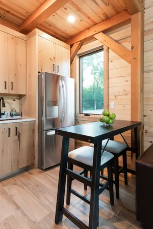 a kitchen with stainless steel appliances a refrigerator sink and cabinets