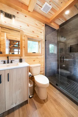 a living room with furniture fireplace and flat screen tv