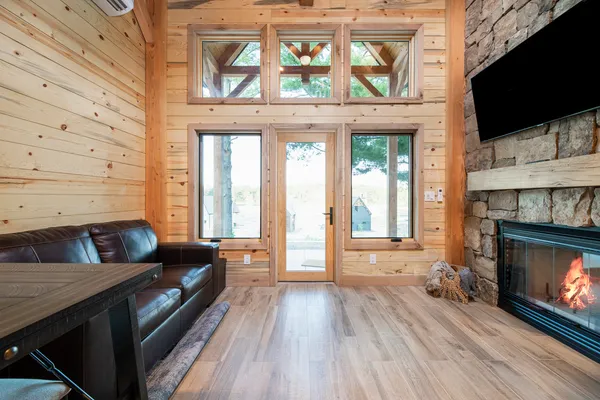 a bedroom with a bed and a large window