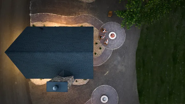 a backyard of a house with wooden floor barbeque oven and outdoor seating