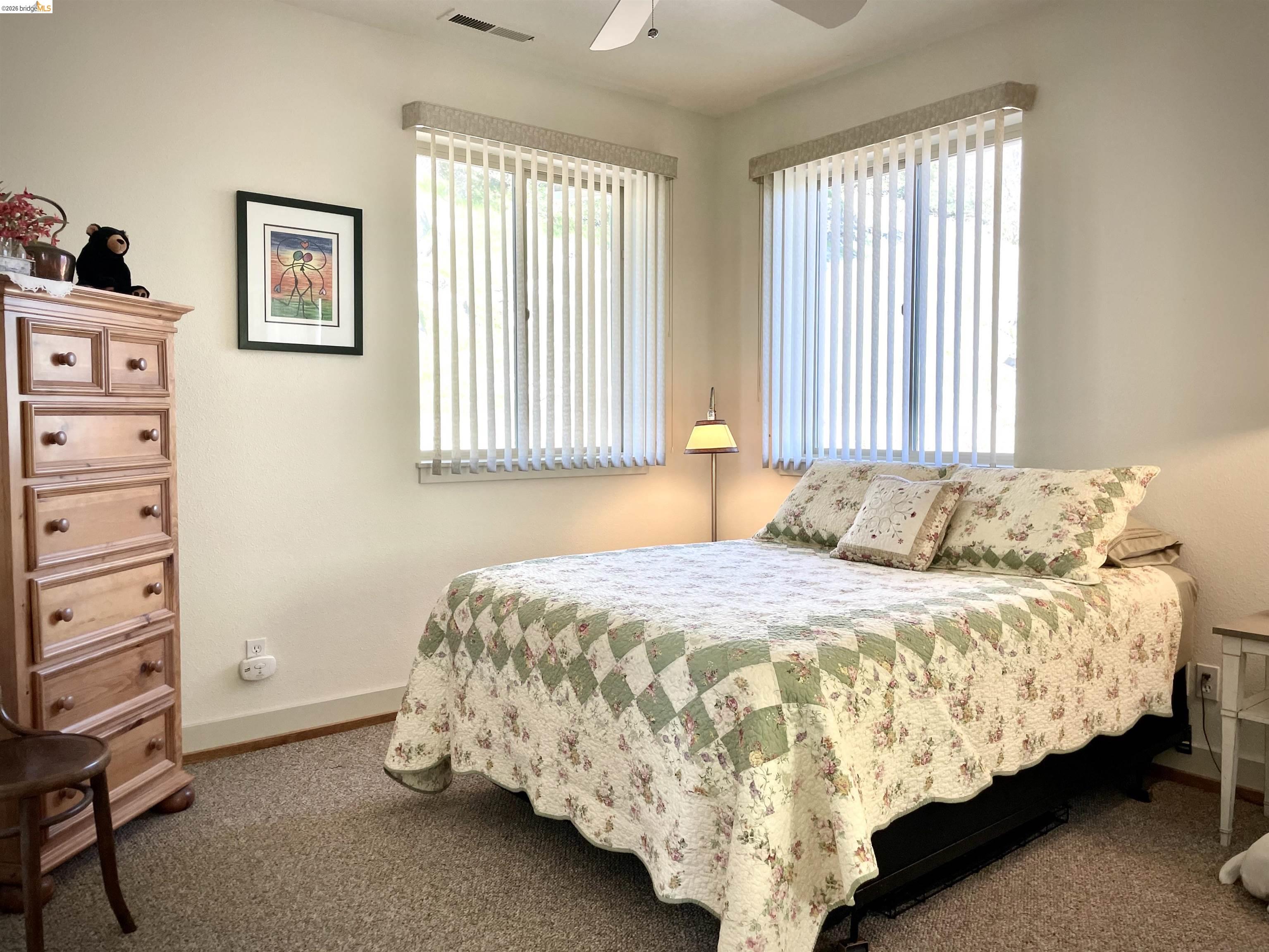 18288 Lambert Lake Road Sonora, CA 95370 - Photo 29 of 55 Bedroom featuring dark colored carpet and a ceiling fan