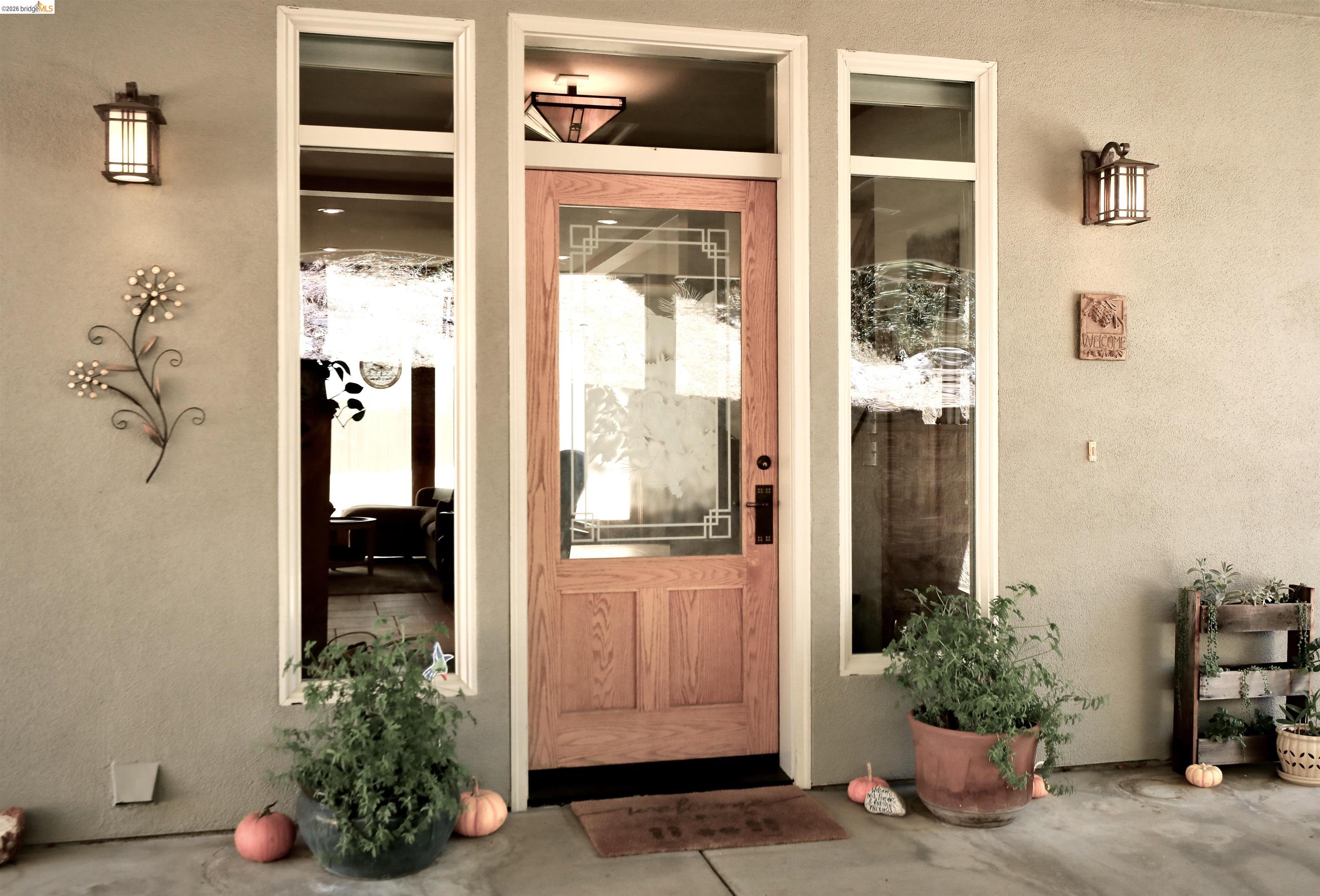 18288 Lambert Lake Road Sonora, CA 95370 - Photo 3 of 55 Doorway to property featuring stucco siding