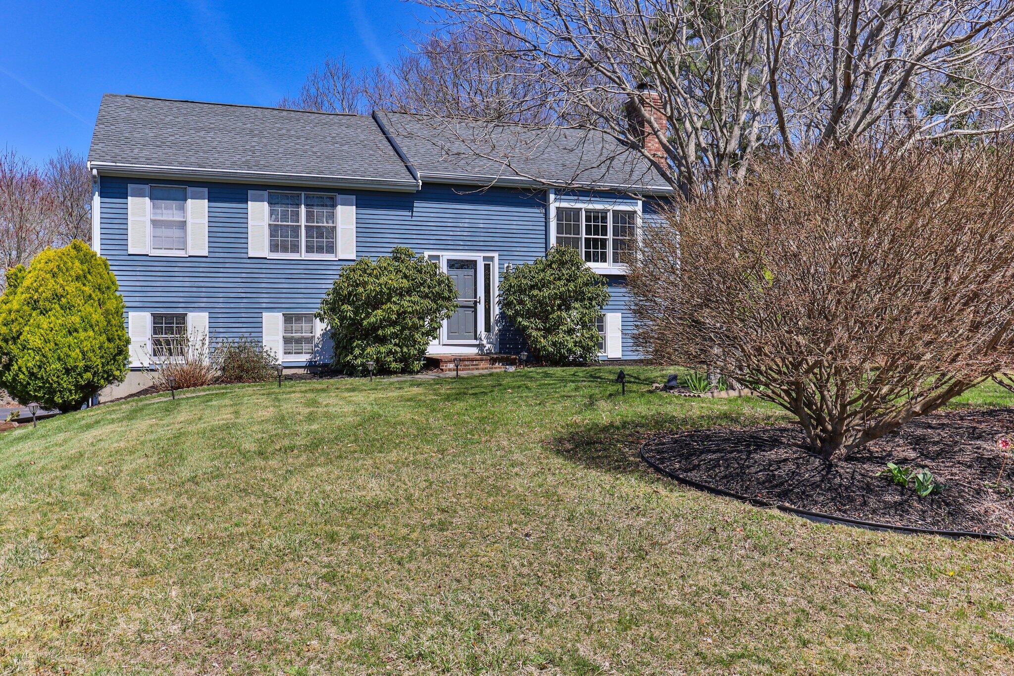 9 Forest Road Forestdale, MA 02644 - Photo 1 of 29 a view of a house with brick walls and a yard with plants