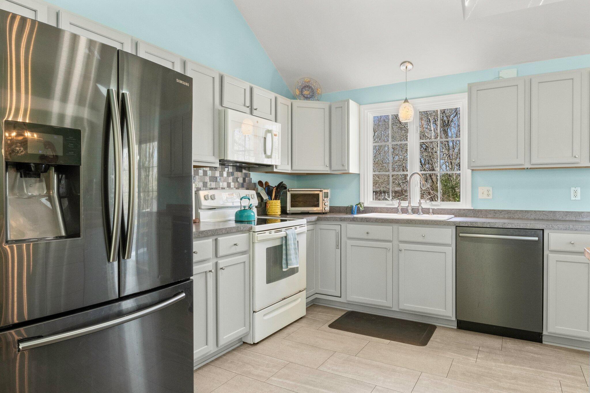 9 Forest Road Forestdale, MA 02644 - Photo 11 of 29 a kitchen with a refrigerator sink and cabinets