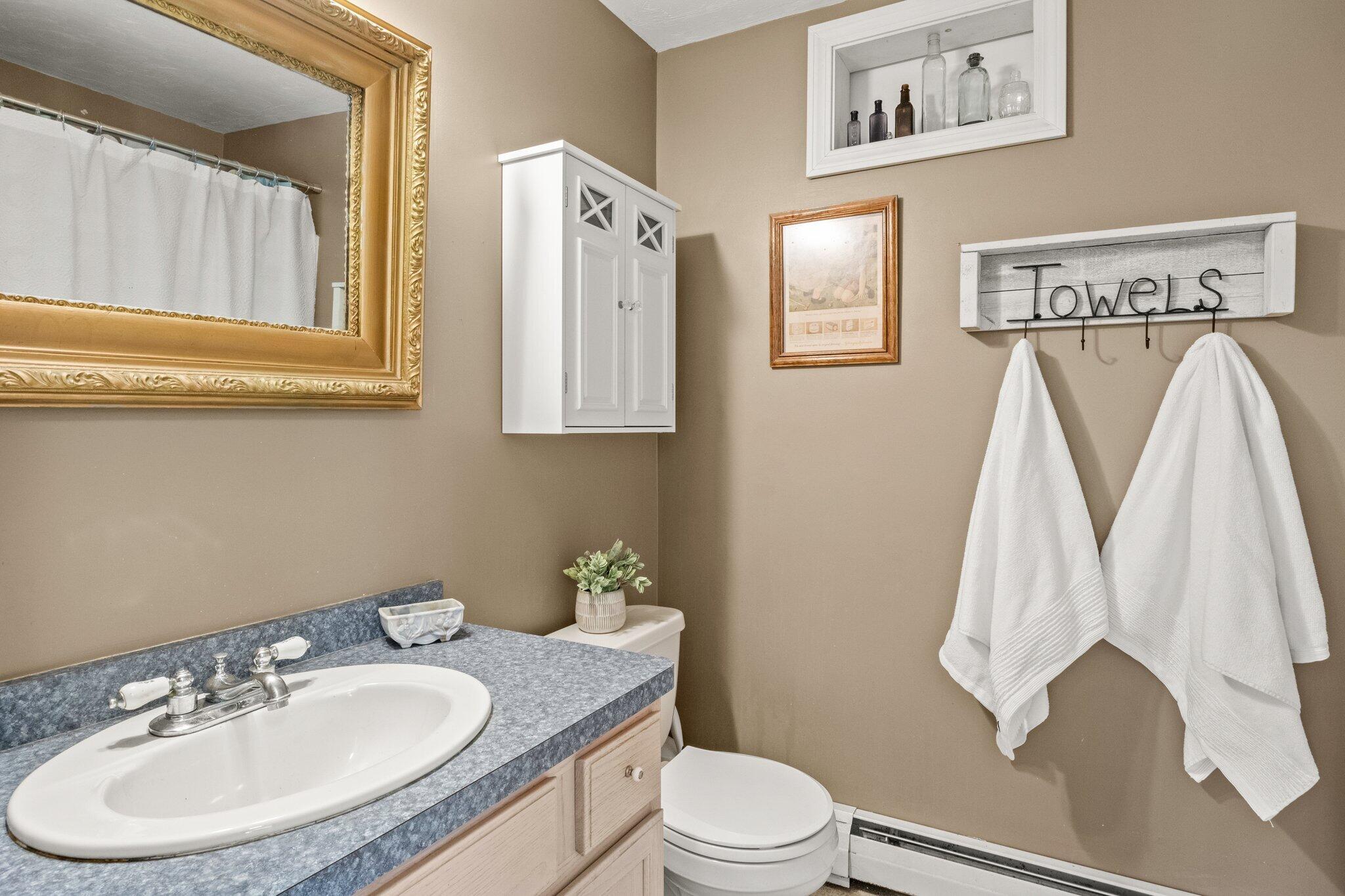9 Forest Road Forestdale, MA 02644 - Photo 12 of 29 a bathroom with a granite countertop sink and a mirror