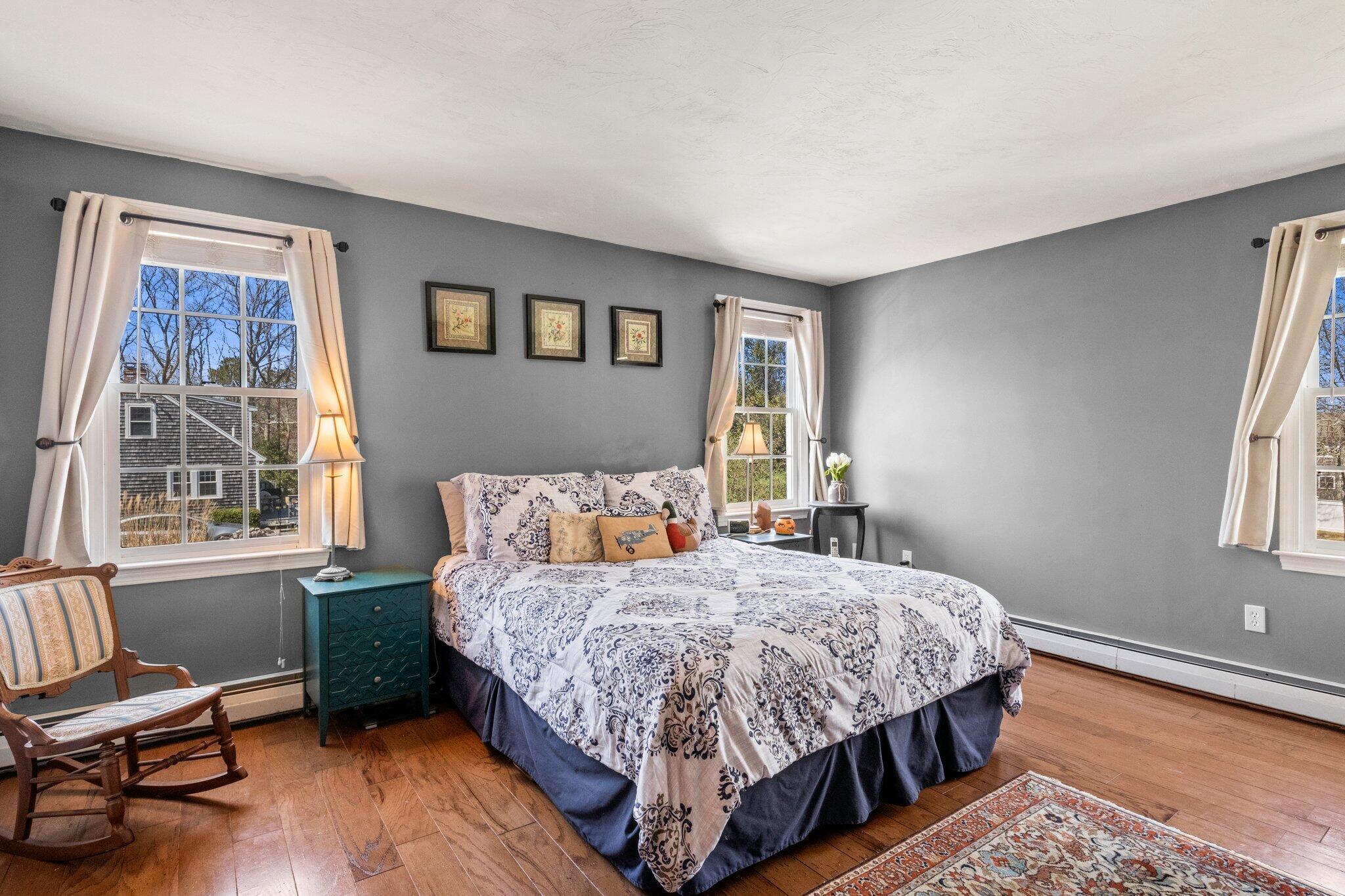 9 Forest Road Forestdale, MA 02644 - Photo 15 of 29 a bedroom with a bed wooden floor and a window