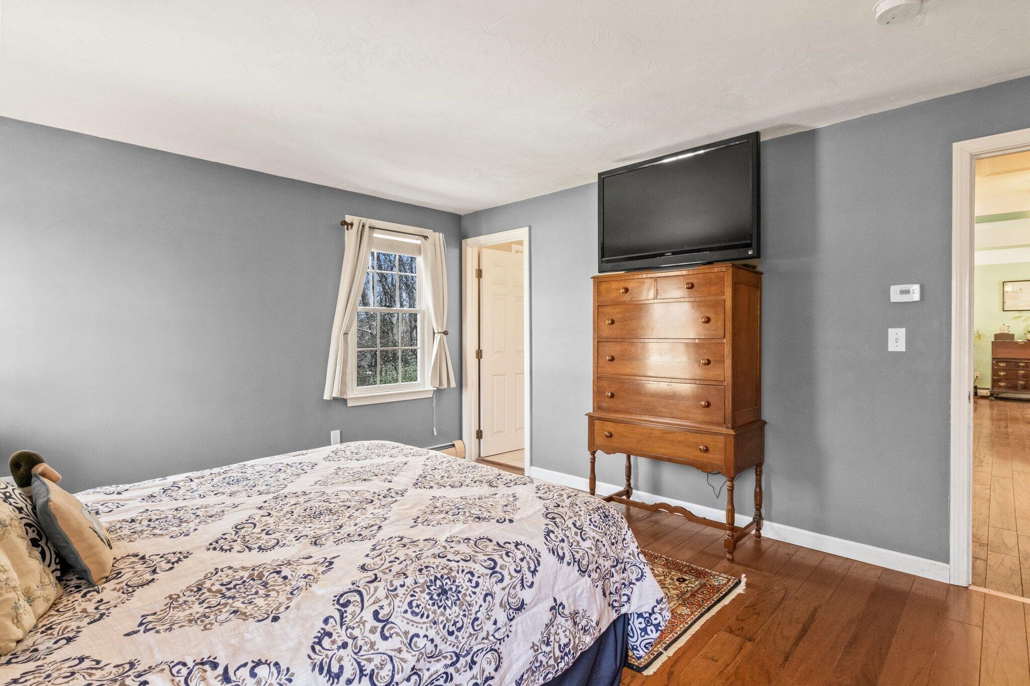 9 Forest Road Forestdale, MA 02644 - Photo 16 of 29 a bedroom with a bed and wooden floor