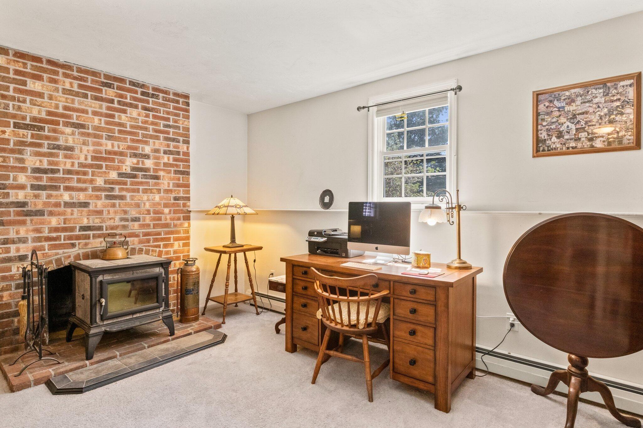 9 Forest Road Forestdale, MA 02644 - Photo 21 of 29 a view of a workspace with furniture and a fireplace