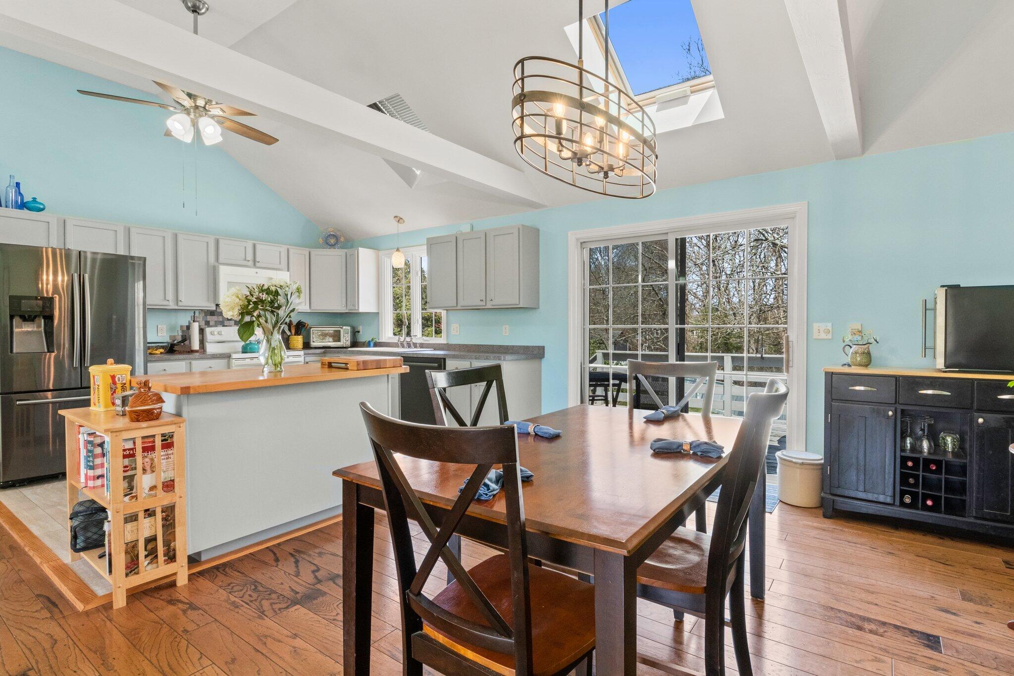 9 Forest Road Forestdale, MA 02644 - Photo 9 of 29 a dining room with furniture a chandelier and wooden floor