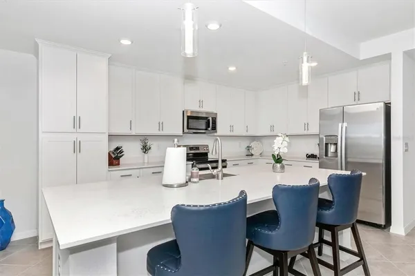 a view of a dining room with furniture and a window