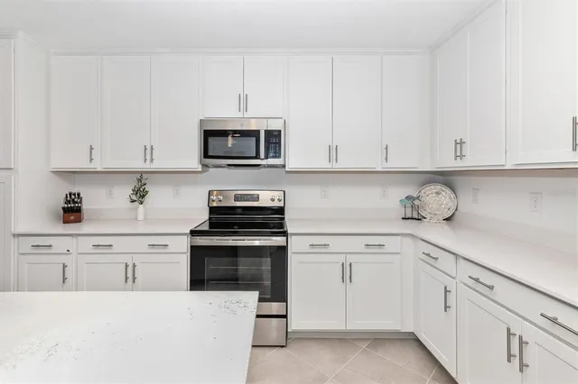 a view of a dining room with furniture and window