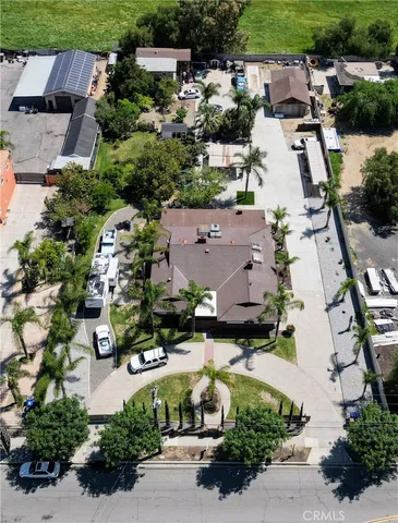 an aerial view of multiple houses with yard