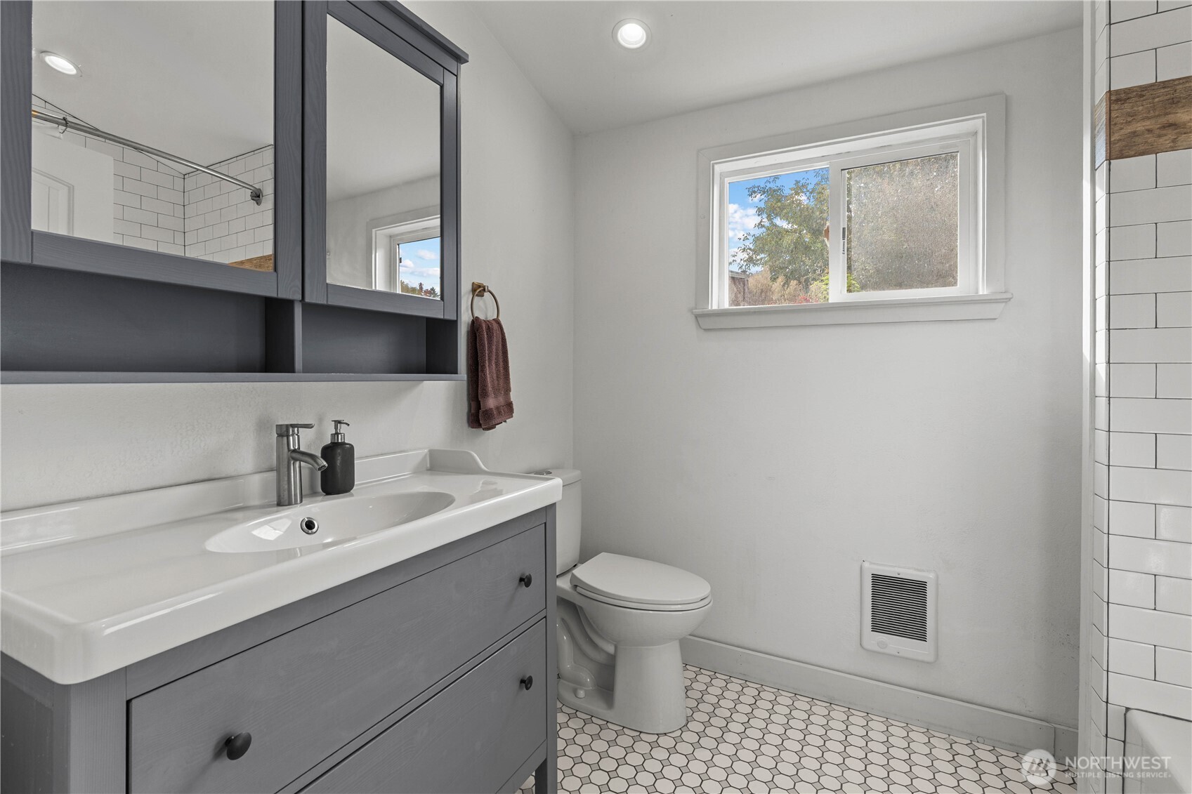 624 West Main Street Sumner, WA 98390 - Photo 14 of 34 a bathroom with a sink a toilet and mirror