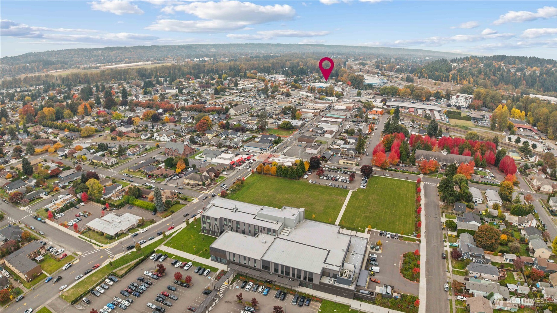 624 West Main Street Sumner, WA 98390 - Photo 32 of 34 an aerial view of a houses with a swimming pool