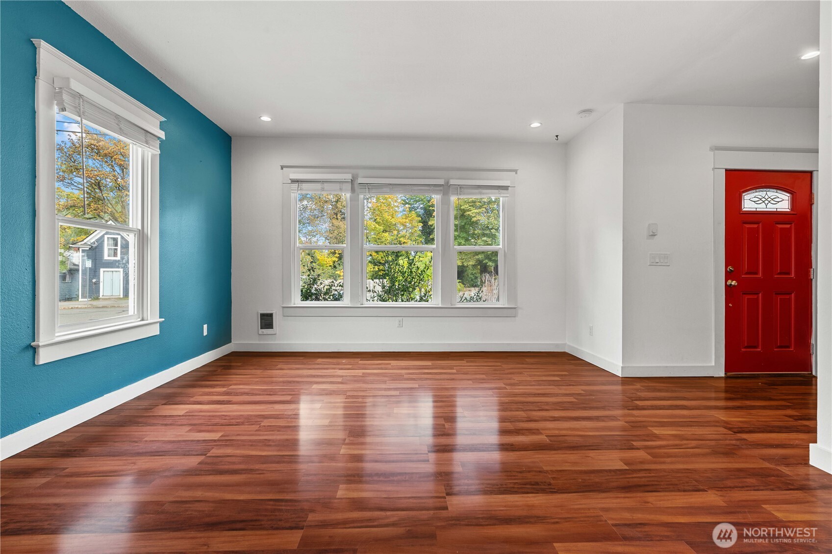 624 West Main Street Sumner, WA 98390 - Photo 6 of 34 a view of an empty room with wooden floor and a window