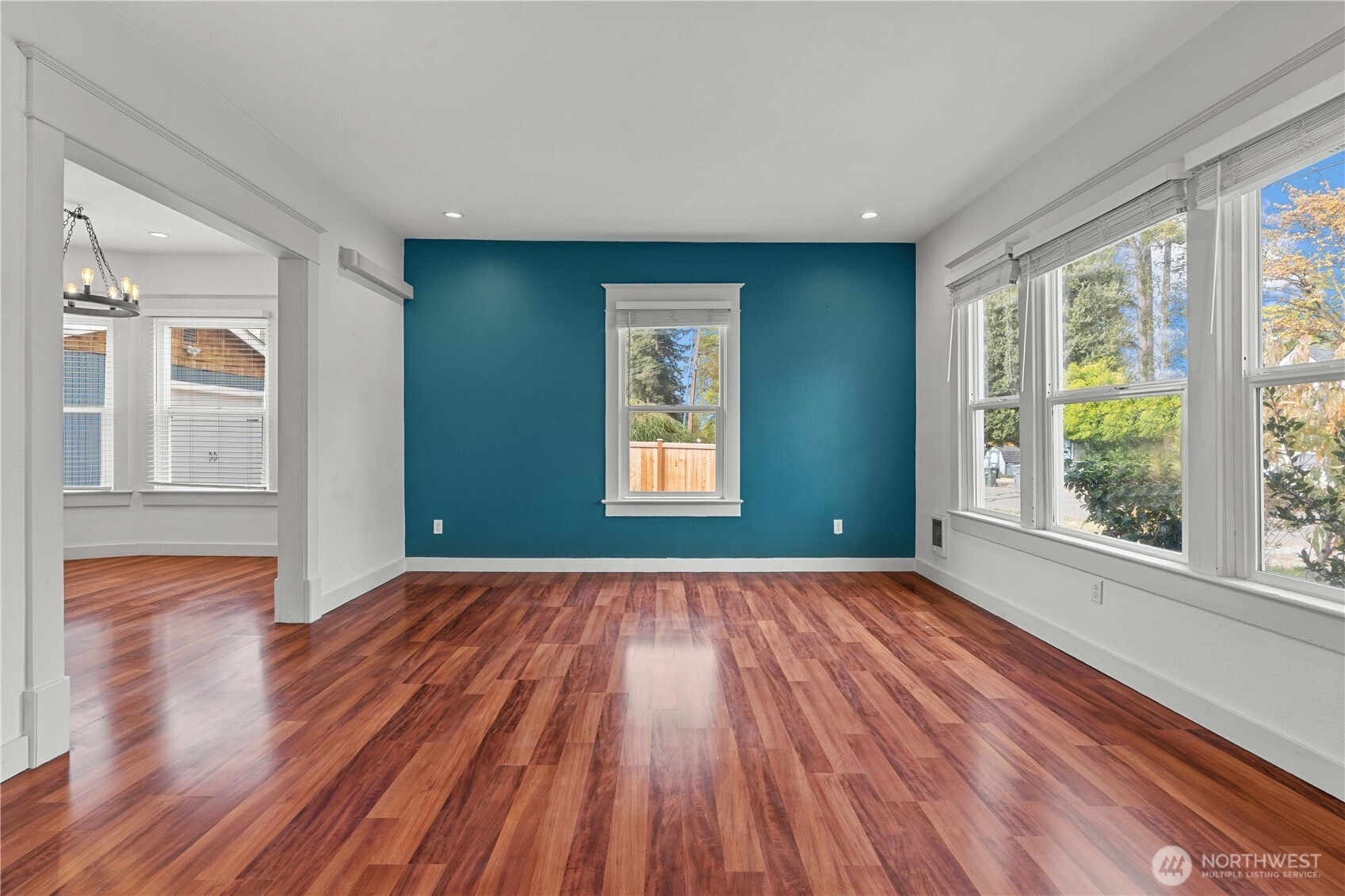 624 West Main Street Sumner, WA 98390 - Photo 7 of 34 a view of an empty room with wooden floor and a window