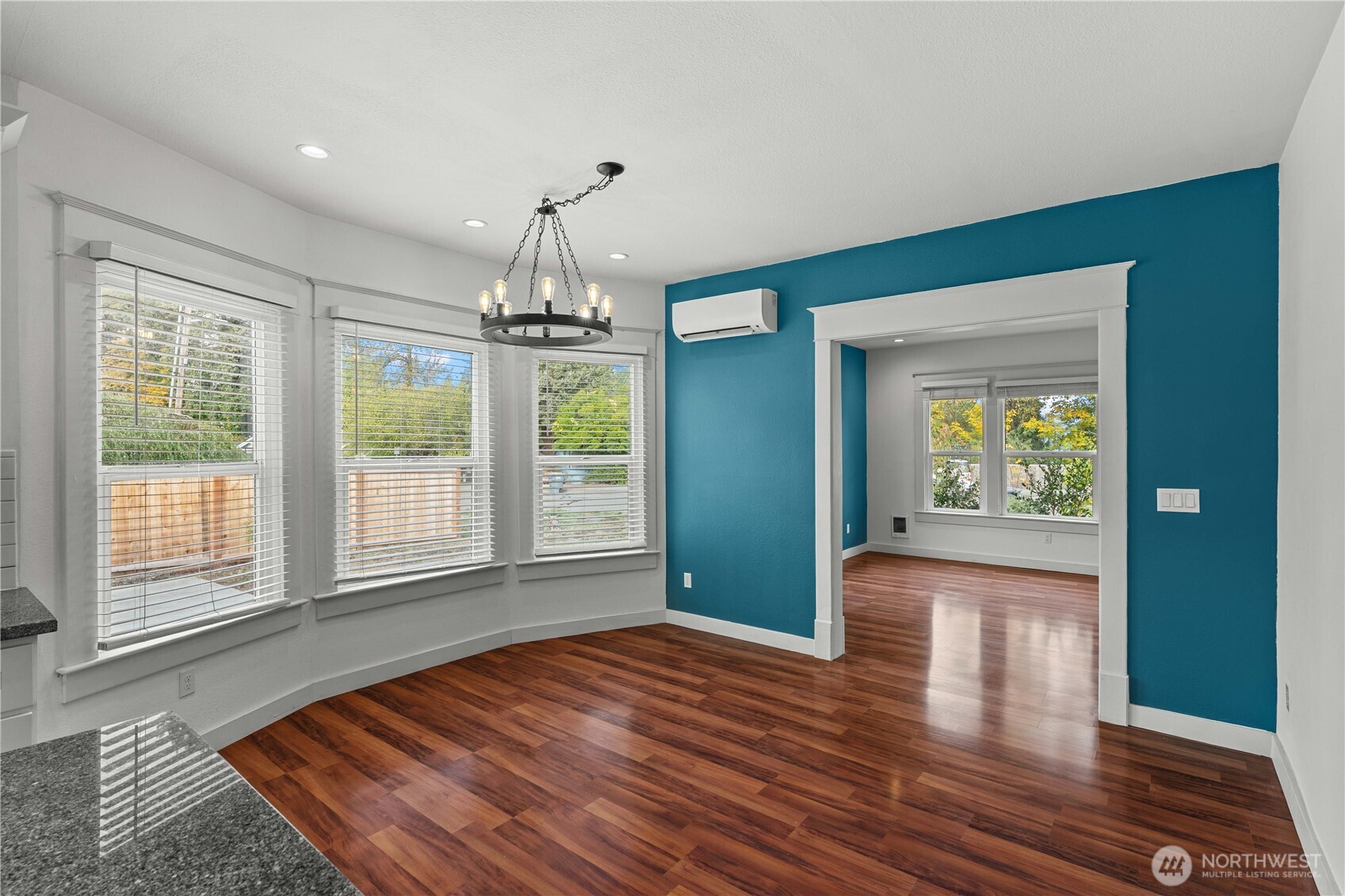 624 West Main Street Sumner, WA 98390 - Photo 8 of 34 a view of an empty room with wooden floor and a window