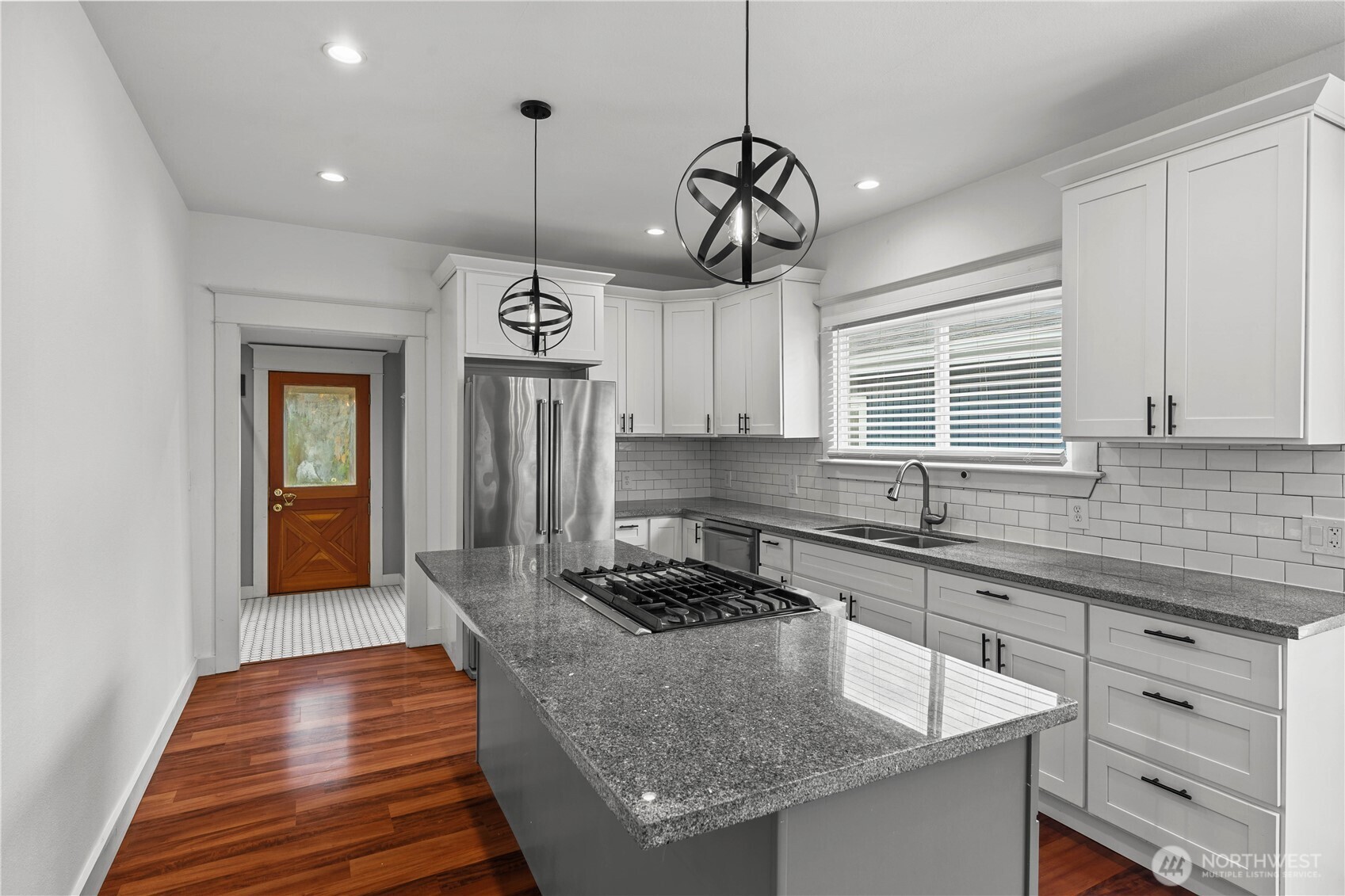 624 West Main Street Sumner, WA 98390 - Photo 10 of 34 a kitchen with a counter space a sink and cabinets