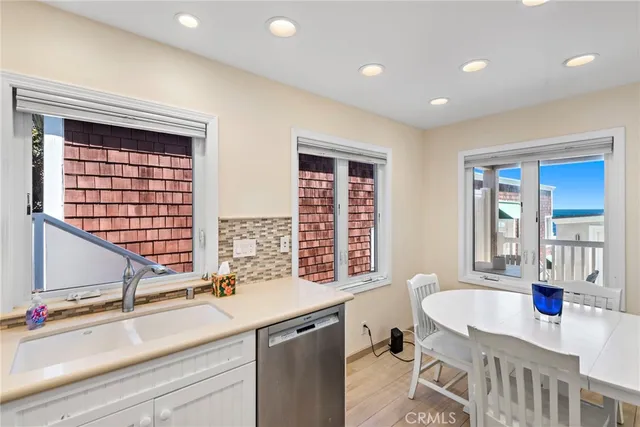 a kitchen with a sink and a window