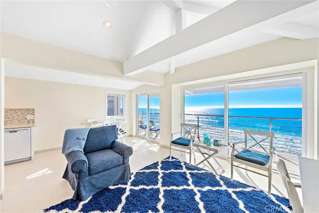 a living room with furniture wooden floor and a rug