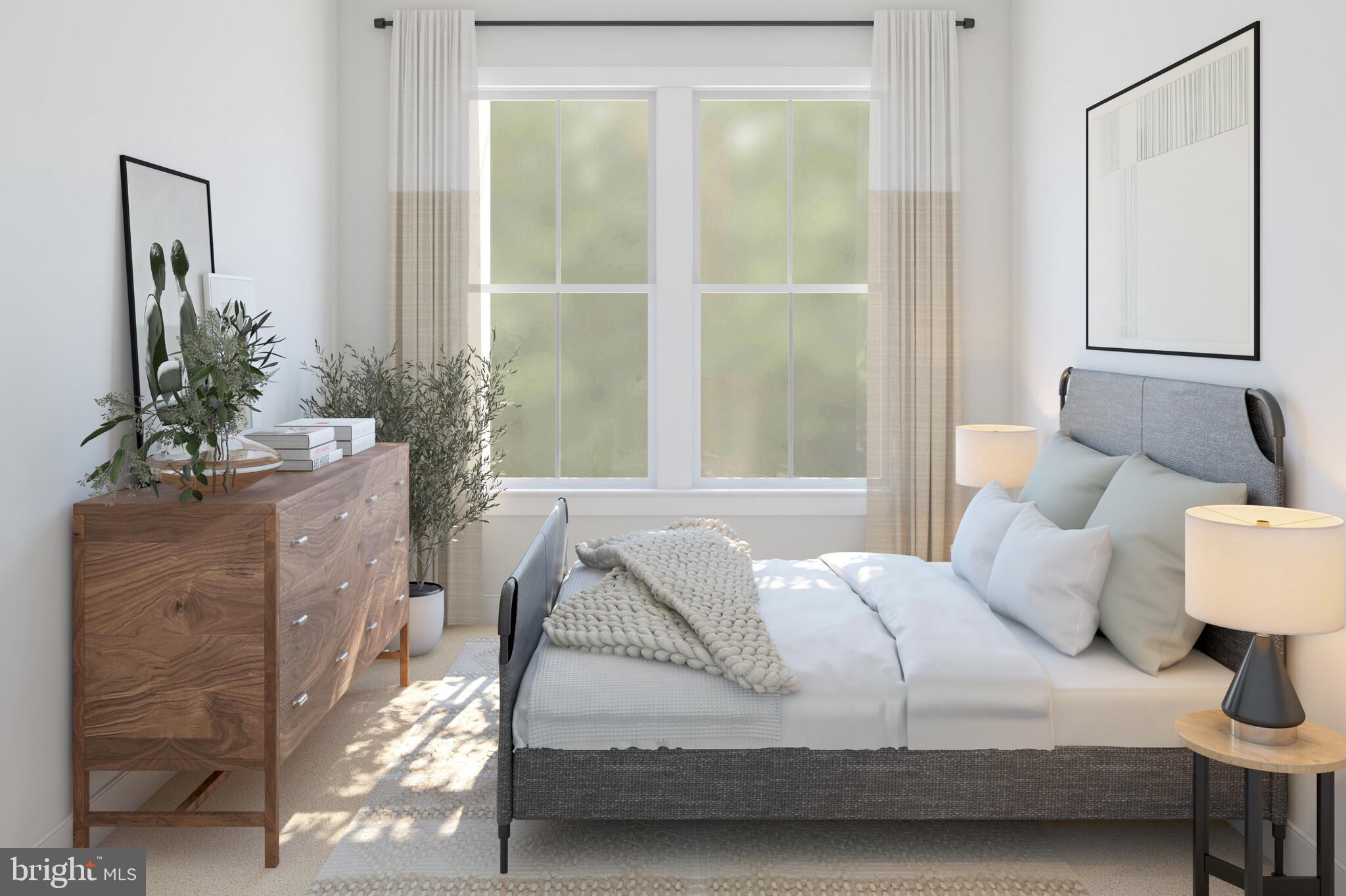 11954 Cygnet Street Lewes, DE 19958 - Photo 15 of 15 a bedroom with a bed and a mirror