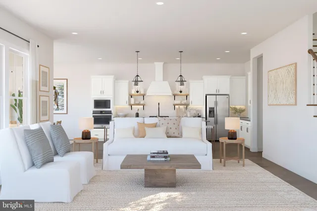 a living room with furniture white walls and white walls