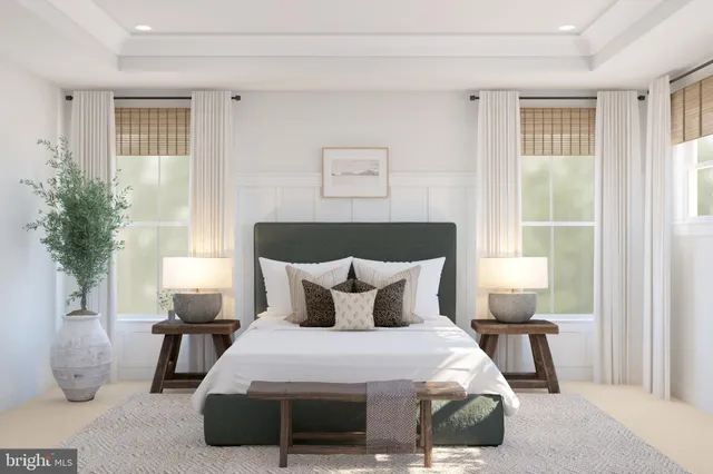 a bedroom with furniture and a window