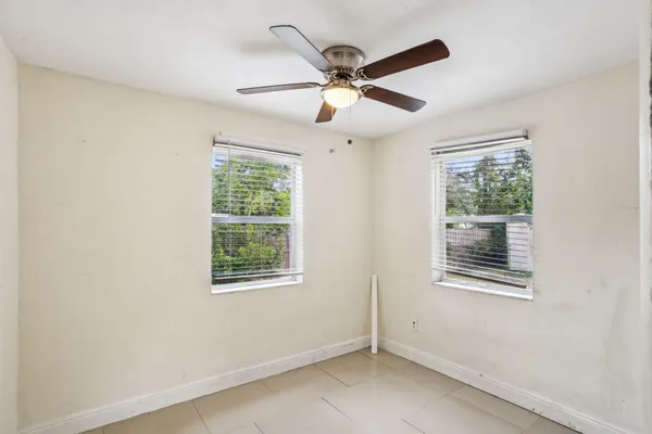 a view of an empty room with a window