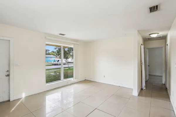 a view of an empty room with a window