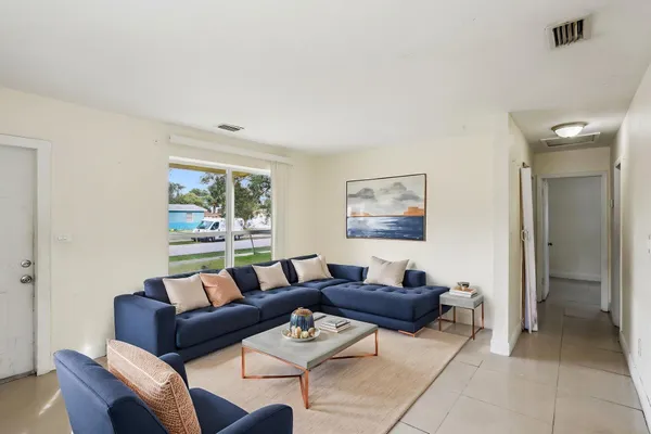 a living room with furniture and a window