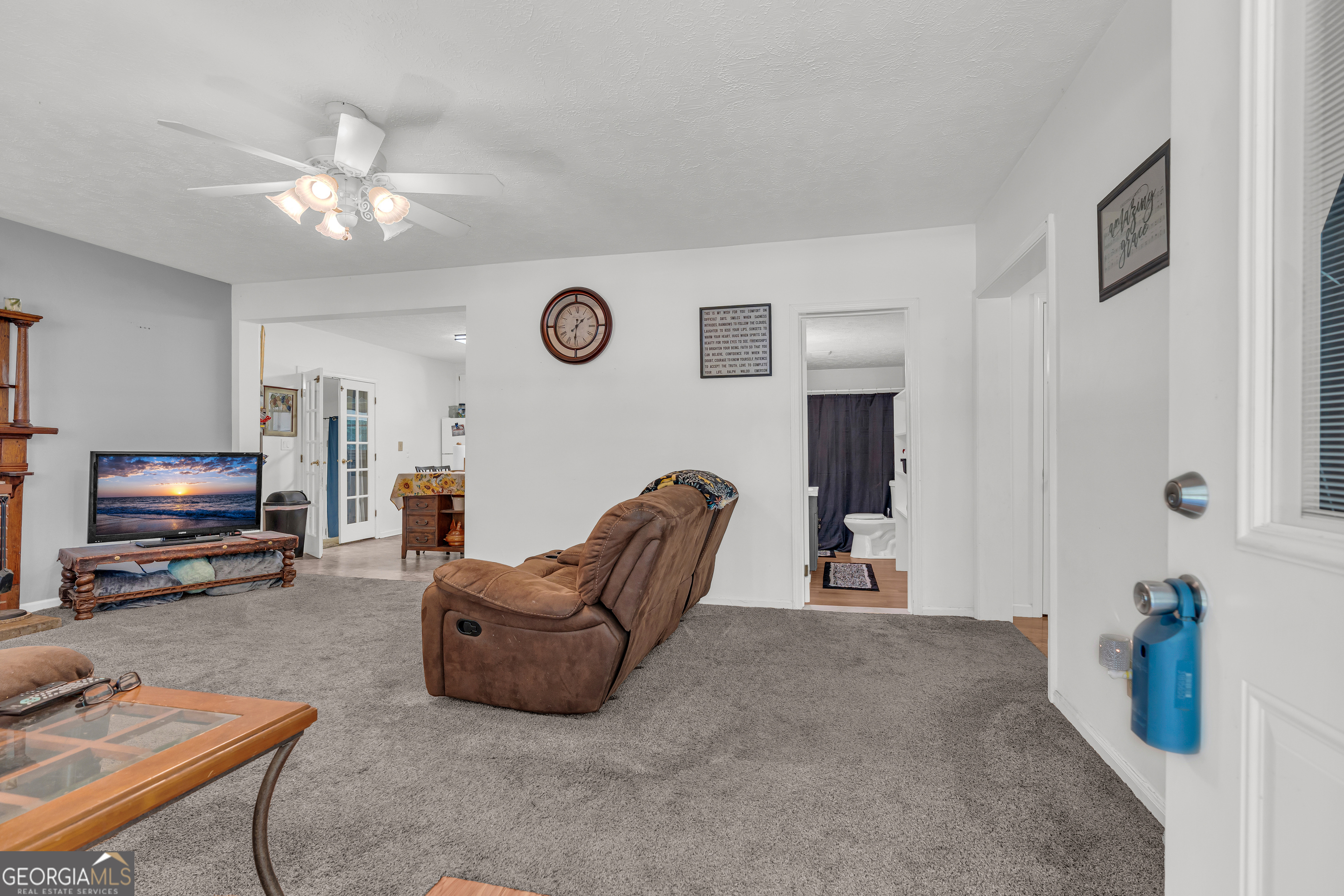 878 Jackson Street Locust Grove, GA 30248 - Photo 12 of 65 a living room with furniture and a flat screen tv