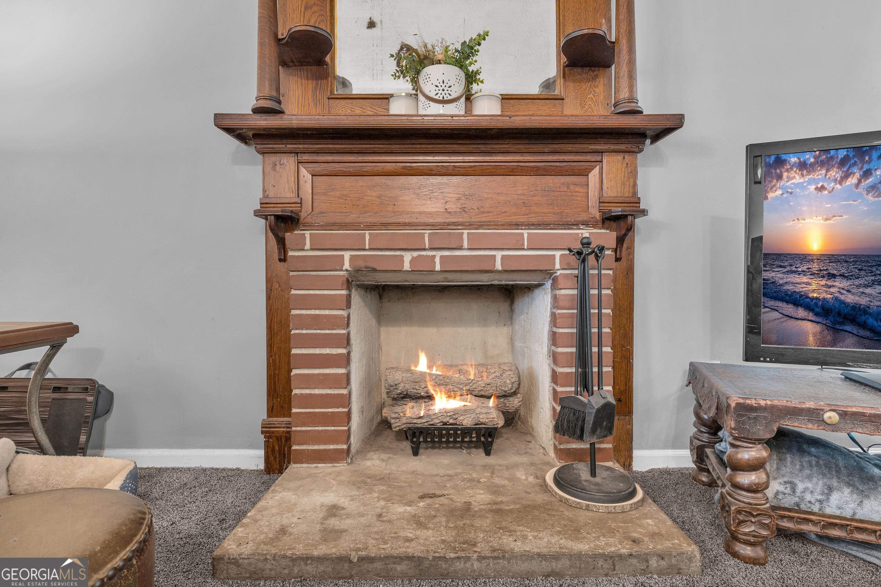 878 Jackson Street Locust Grove, GA 30248 - Photo 13 of 65 a living room with furniture and a fireplace