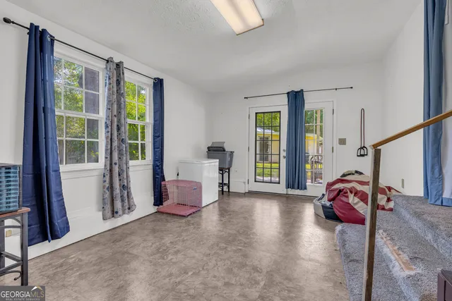 a bedroom with a bed and the view of bedroom