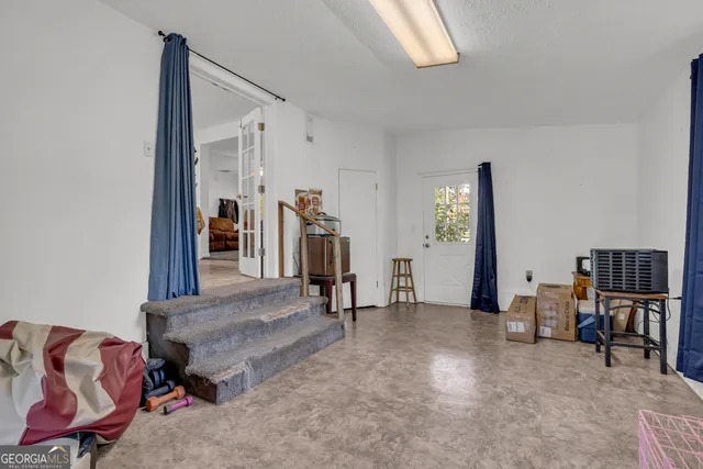 a bedroom with a bed and a table