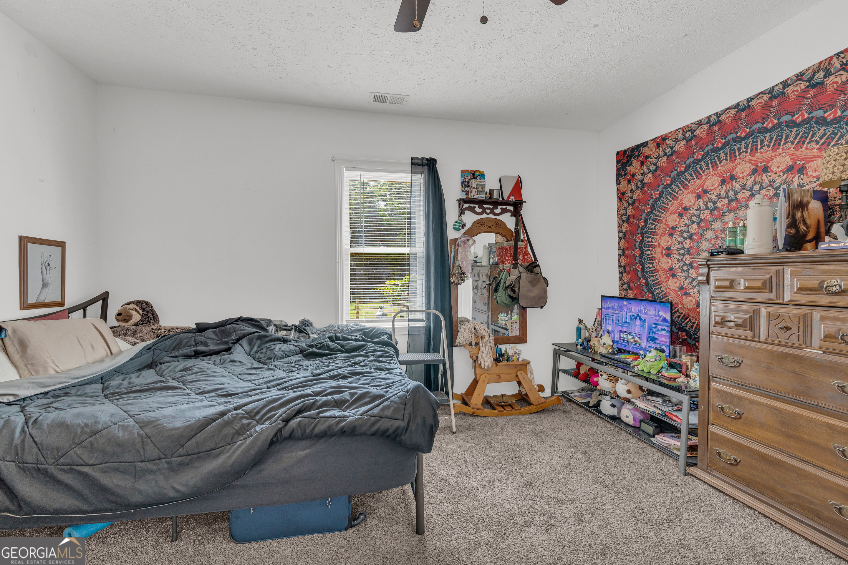878 Jackson Street Locust Grove, GA 30248 - Photo 32 of 65 a bedroom with a bed and the view of bedroom